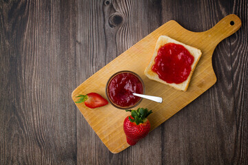 Wall Mural - Strawberry jam in the glass jar with fresh berries.