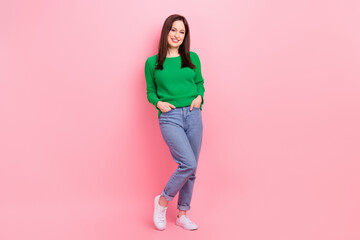 Wall Mural - Full size photo of satisfied glad girl put hands pockets posing good mood isolated on pink color background