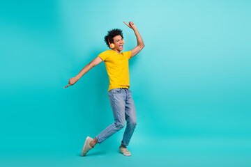 Poster - Full size photo of overjoyed cheerful person point fingers dancing listen music isolated on turquoise color background