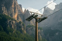 Low-angle Of Palm Springs Aerial Tramway With A Sunny And Misty Mountains And Sky Background