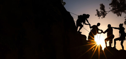 group of hikers helping each other climb up the mountain.