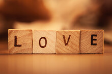 Close-up Of Wooden Blocks Spelling The Word Love