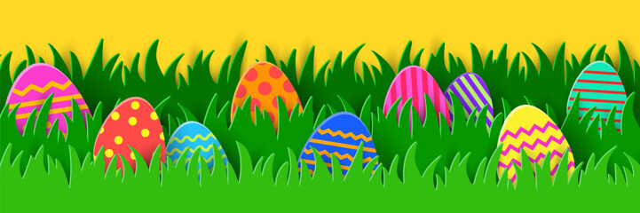 Wall Mural - Easter banner with painted eggs in the spring grass. Paper cut style decoration. Panoramic header. Vector illustration