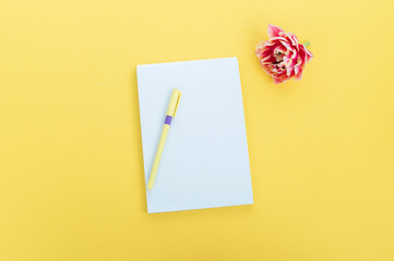 Wall Mural - Creative flat photography desktop. Top view yellow desk with blank notebooks mockup with pencil