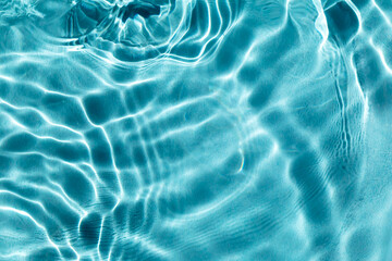 Wall Mural - Blue water in the pool. Light shimmers on the waves of clear water. Selective focus, defocus