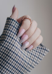 Wall Mural - Beautiful pink nail manicure. Stylish pastel pink manicure. Nail polish. Art pink manicure. Female hands manicure close up view.