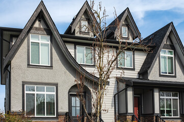 Brand new upscale townhomes in a Canadian neighbourhood. External facade of a row of modern urban townhouses