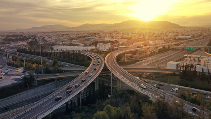 Wall Mural - Aerial drone multilevel junction overpass highway with National toll road at rush hour with moderate traffic