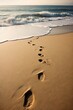 Traces de pas dans le sable.