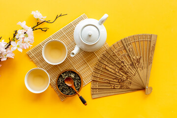 Wall Mural - Japanese table setting with teapot and cups of tea