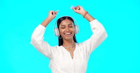 Poster - Face, music and Indian woman with headphones, streaming and happiness against blue studio background. Portrait, female and lady with headset, listening to song and dancing with success and celebrate