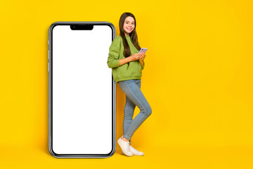 Poster - Full size profile side photo of young girl use mobile gadget app download web presenting isolated over yellow color background