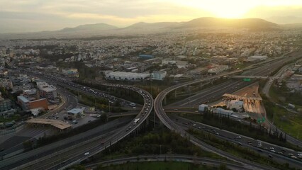 Wall Mural - Aerial drone video of multilevel junction overpass highway with National toll road at rush hour with moderate traffic