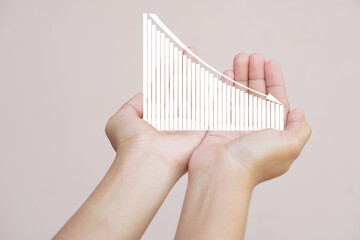 Poster - earnings graph in human hand