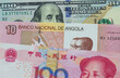 A Chinese Yuan Note With An American One Hundred Dollar Bill With Money From Angola
