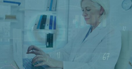 Canvas Print - Animation of screens of data processing over caucasian senior female doctor using laptop at hospital