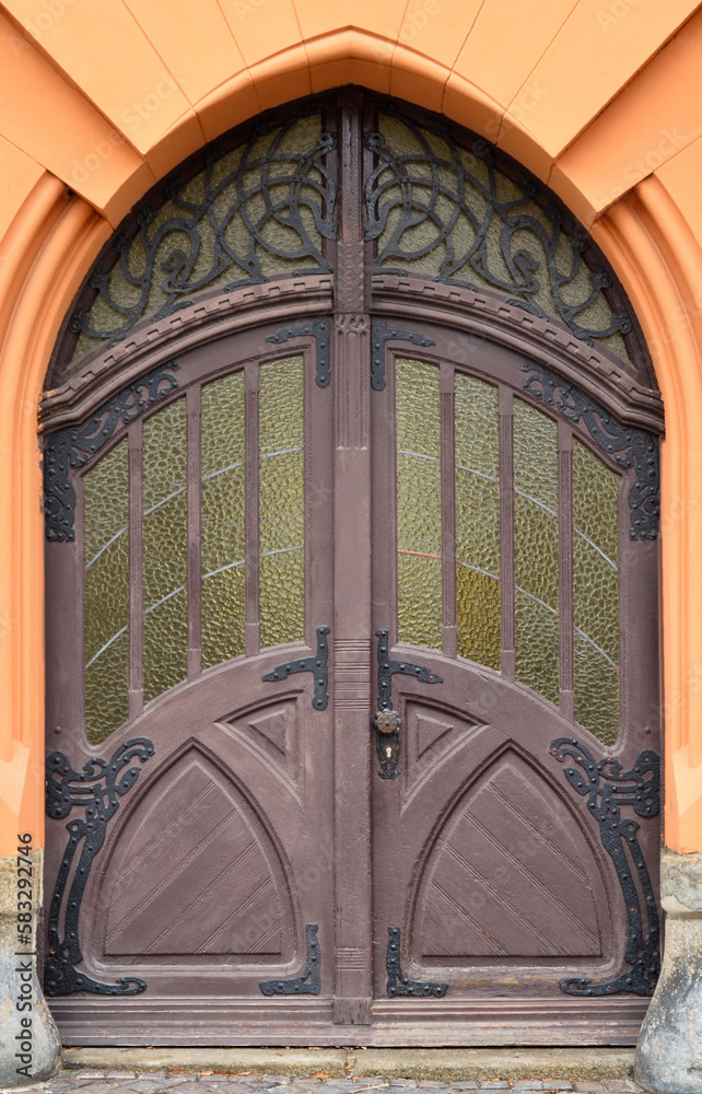 View of old building with wooden door