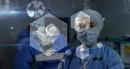 Poster - Animation of medical icons over biracial female surgeon in operation theatre at hospital