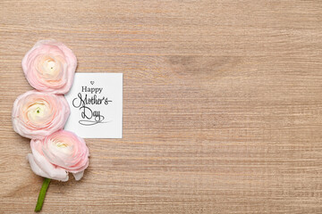 Canvas Print - Card with text HAPPY MOTHER'S DAY and beautiful ranunculus flowers on wooden background