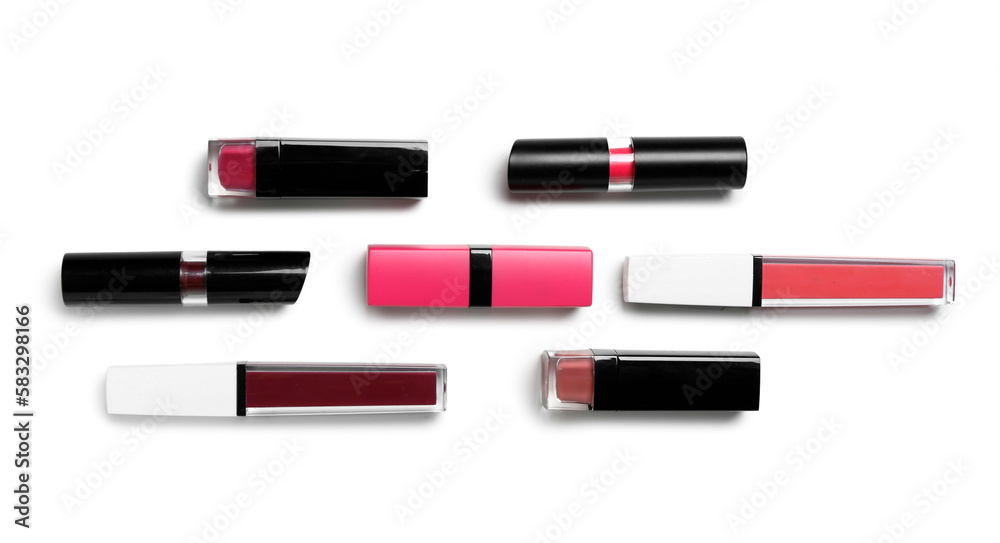 Composition with different lipsticks on white background