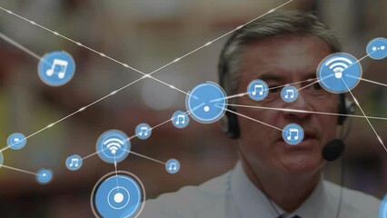 Poster - Animation of network of connections over caucasian businessman using phone headset in warehouse