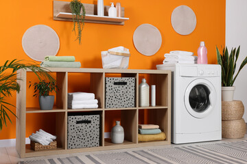 Stylish laundry room with washing machine. Interior design