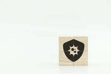 Poster - Wooden block with a cyber security shield symbol, representing protection against digital threats in a minimalist setting.