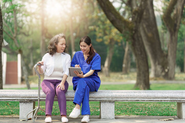 Healthcare nurse, physical therapy with elderly woman at outdoor. Nurse holding hand and help elderly woman