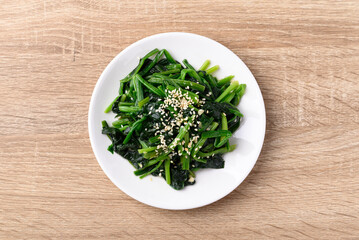 Wall Mural - Korean spinach salad (Sigeumchi namul), Korean side dish, Table top view