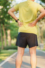 Wall Mural - adult male with her muscle pain during running. runner man having back and Waist body ache due to Piriformis Syndrome, Low Back Pain and Spinal Compression. Sports injuries and medical concept