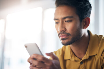 Poster - Serious asian man, phone and social media for communication or networking at home. Focused male freelancer face on mobile smartphone app for chatting, texting or browsing on internet or research