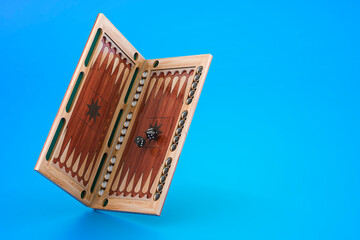 Poster - Backgammon, board game on blue background, 3D rendering