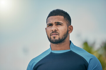 Poster - Sport, sky and man with serious expression, confidence and pride in winning game with focus. Fitness, sports and dedication, rugby player at match, workout or competition at stadium in New Zealand.