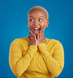 © Lune/peopleimages.com - Black woman, happy and surprise face in studio for fashion, youth or notification by blue background. Young african girl, model or happiness with excited wow, announcement or deal with hands by mouth