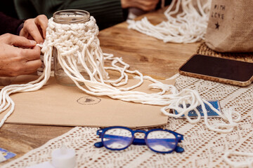 Wall Mural - White macrame. Older ladies working macrame together.