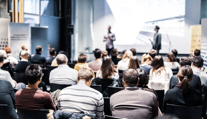 Wall Mural - speaker giving a talk in conference hall at business event. audience at the conference hall. busines