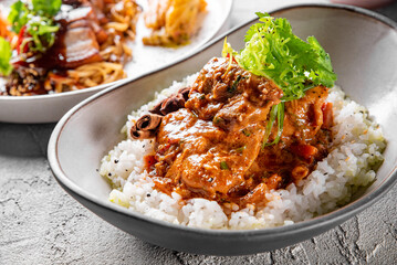 Poster - Spicy chicken cooked with curry sauce and rice in bowl