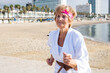 Mature woman running on beach