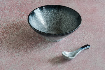 empty ceramic bowl in pink background