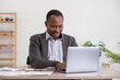© Natee Meepian - Accountant black man working on laptop and do document, tax, exchange, accounting and Financial advisor concept