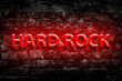 Hard Rock. Neon sign. On old vintage bricks wall. Direction in music. Musical style. Design