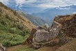 Aerial view of ruins on the mountain peaks in Inca Trail, Peru, covered with green plants