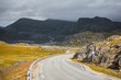 Winding road of Northern Norway to Havoysund against the gloomy sky