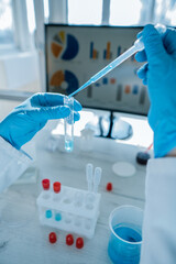 Aufkleber - Medical research laboratory. A scientist works with a pipette and a test tube. Scientific laboratory of biotechnology, development of medicine and research in chemistry, biochemistry and experiments.