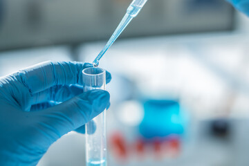 Aufkleber - Medical research laboratory. A scientist works with a pipette and a test tube. Scientific laboratory of biotechnology, development of medicine and research in chemistry, biochemistry and experiments.