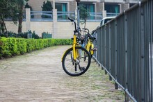 Selective Focus Shot Of Yellow Bikes Parked Outside
