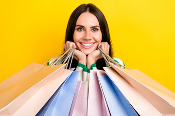 Canvas Print - Photo of charming pretty lady dressed striped pullover smiling holding bargains arms cheeks isolated yellow color background