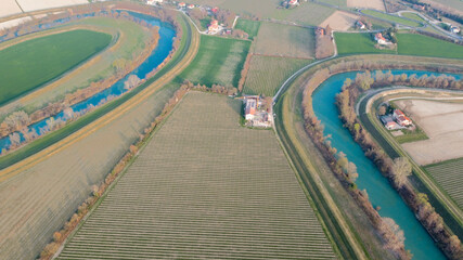 Aerial photo of a vineyard field with wine and river. Motta di Livenza, bright and spring colours.