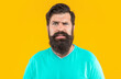 © be free - photo of puzzled bearded man with moustache. bearded man isolated on yellow.
