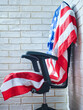 the concept of the presidential election in america the american flag on an empty chair